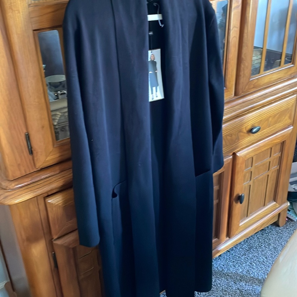 Lady sweater jacket size medium knee length very thick and warm